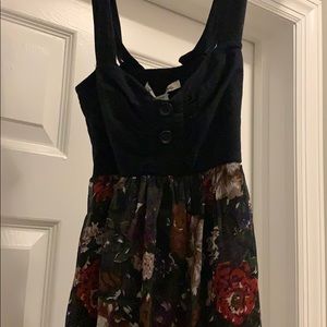 a dress with flowers on bottom